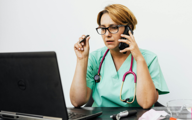 Veterinarian talking on phone