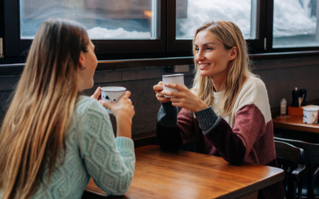 Two-women-drinking-coffee-talking